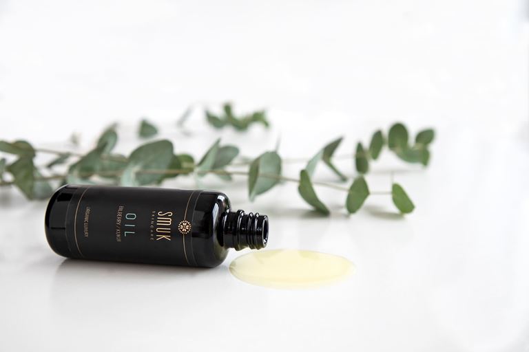 Flaske med SMUK skincare økologisk ansigtsolie