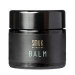 Sort dåse med SMUK skincare økologisk balm